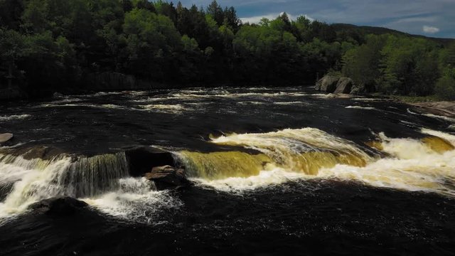 Flying low towards Nesowdnehunk Falls on the Penobscot River in Baxter State Park AERIAL