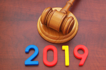 Wooden judge gavel and numbers 2019.