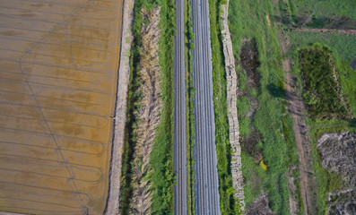 aerial view from flying drone of railroad tracks, train