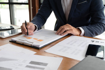 Businessmen, finance, accounting work, checking accounts, using calculators and finding information