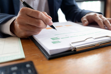 Businessmen, finance, accounting work, checking accounts, using calculators and finding information