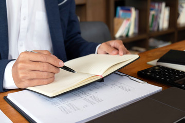 Businessmen, finance, accounting work, checking accounts, using calculators and finding information