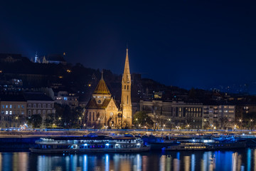 Night view of the Matthias Church and River Danube bank