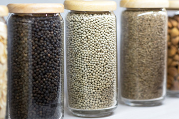 Set of dried spices and herbs in glass bottles , Variety of spices