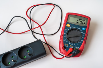 Measurement of voltage in electrical socket - digital multimeter