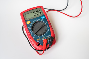 Red digital multimeter - isolated on white background