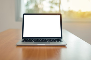 Computer laptop with blank screen on table