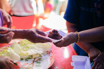 Poor people receiving food from donations : Homeless people are helped with food relief, famine...