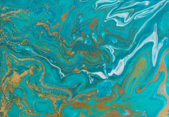 Blue and gold marbling pattern. Golden marble liquid texture.