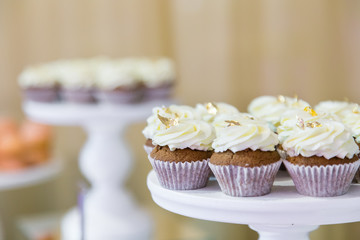 Fresh sweet muffins on a banquet table in restaurant.