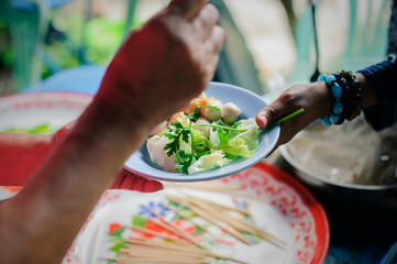 Food needs of the poor in society Help with Food Donation : Homeless people pick up charity food from the food donors in society : The concept of the beggar problem on earth