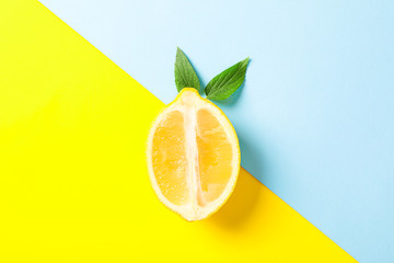 Fresh lemon on two tone background, space for text
