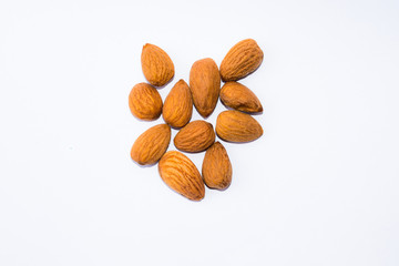 close up of  brown almonds seeds isolated on white background