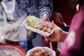 The Concept of Hunger : Food needs of the poor in society Help with Food Donation : Homeless people pick up charity food from the food donors in society : The concept of the beggar problem on earth