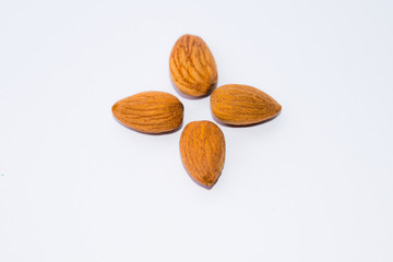 close up of  brown almonds seeds isolated on white background