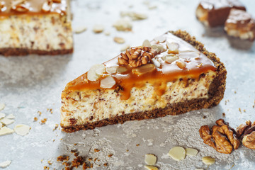 Healthy Cheesecake with Caramel and Walnut Closeup. Fresh Dessert Consisting of Layer Made of...