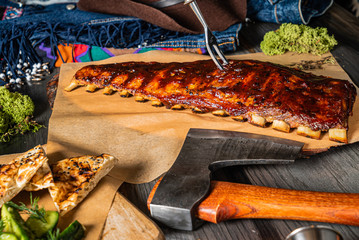 grilled ribs on the wooden board