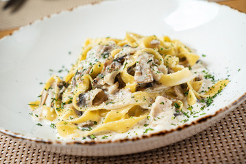 Spaghetti Carbonara with chicken and cheese.