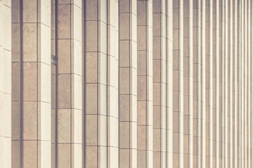 Vertical architecture elements of a modern building as background. Toned image