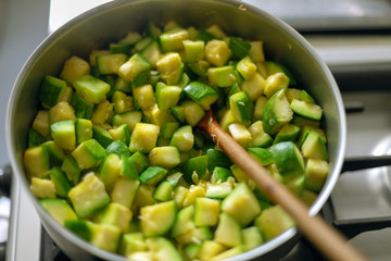Macro close-up of zapallitos cut into pieces boiling in a pan