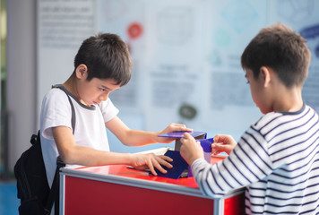 Student boys folded making a cube science education