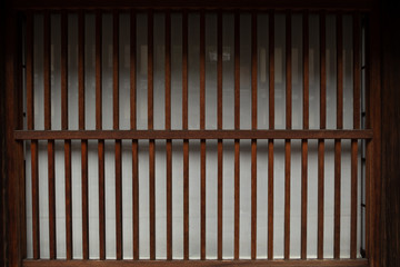 wooden wall of window and old house in Japan. low key and soft focus.