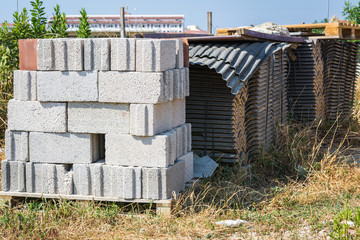 Folded white brick next to the metal roof.