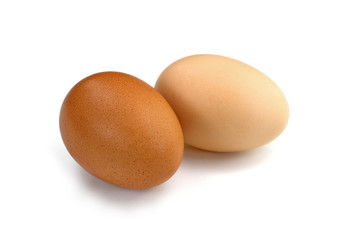 Raw Eggs on White Background.  Brown and white eggs.