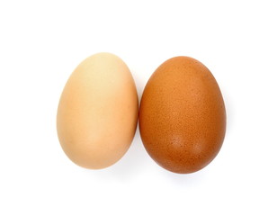 Raw Eggs on White Background.  Brown and white eggs.