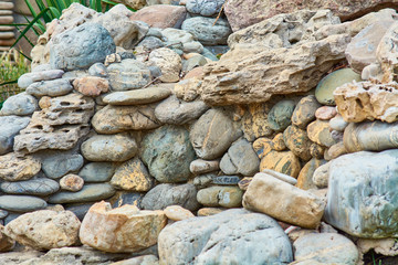 Lined wall of round stones.
