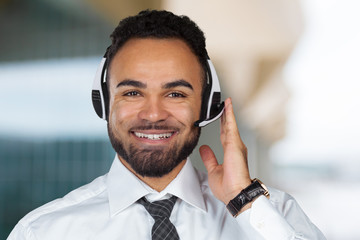 Call center operator man with headsets working