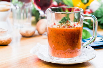 Tomato soup with fresh ingredients in a soup cup