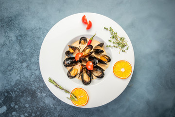 Traditional French Corsican mussel stew with mussels as top view in a pot with copy space