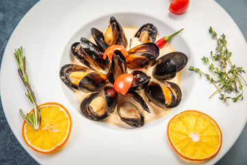 Traditional French Corsican mussel stew with mussels as top view in a pot with copy space