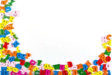 Bright multicolored alphabet background. Multicolored wooden letters on white background. Isolated, Flat Lay, Copy space, top view, space for text.