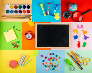 Teaching children of primary school. Bright and multicolored school background with stationery accessories for the study of general subjects. Flat Lay, Copy space, Mock up, top view, place for text.