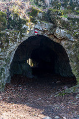 small cave with red marked hiking trail - Pruchodnice cave near Konice city in Czech republic