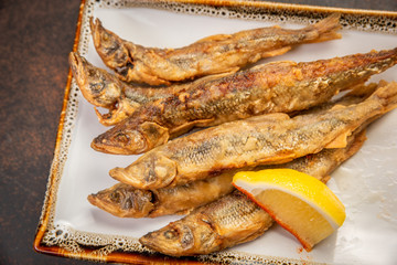 Crispy deep-fried small fish with lemon