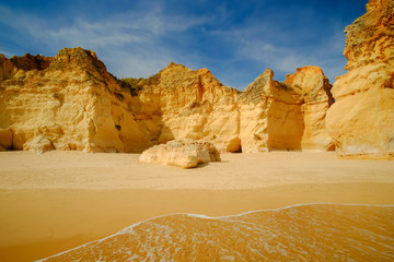 View on beautiful cliffs in Algarve. Beach Careanosy in Portimao. Vacation in Portugal.