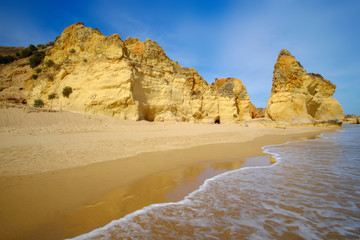 View on beautiful cliff in Algarve. Beach Careanosy in Portimao. Vacation in Portugal.