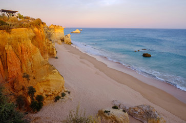 Fototapeta na wymiar View on the beach Careanosy in Portimao with beautiful cliffs on the sunset. Vacation in Portugal.