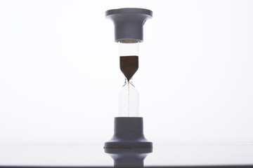 Sandglass running out of sand, time out