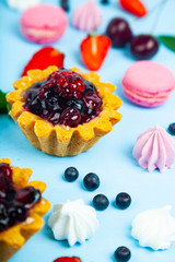 Small berry cake and ripe berries