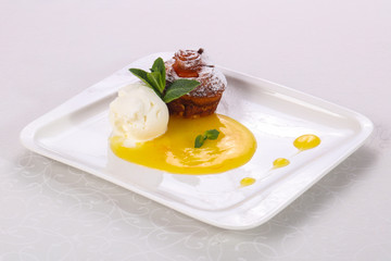 Tasty hot muffin with ice cream