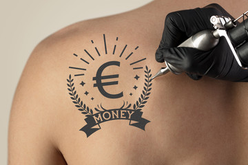 Hand tattooing money and currency concept on naked clear skin