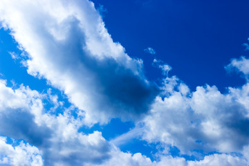Naklejka na ściany i meble Clouds and blue sky background with copy space