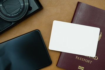 Card Mockup on passport with smartphone and camera