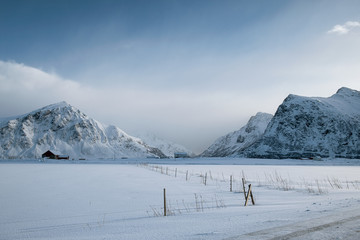 Fototapeta na wymiar Scenery of snow mountain range with overcast sky in winter