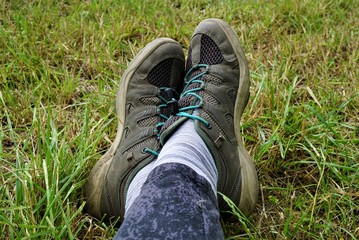 sitting on grass showing only the feet