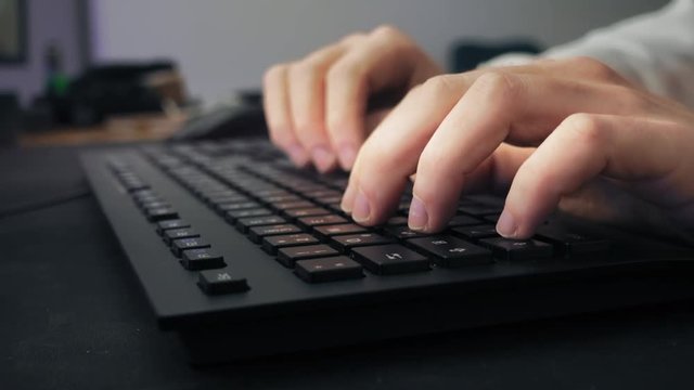 Closeup Of A Male Gamer Writing On The Keyboard